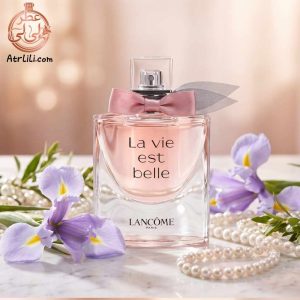 بطری لا ویه است بل روی میز آرایش با نمایی از ایفل